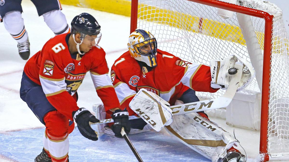 Florida Panthers goalie Roberto Luongo (1) and defenseman Alex Petrovic (6) block a shot by Edmonton Oilers center Leon Draisaitl (29) during the first period of an NHL regular season hockey game at the BB&T Center on Thursday, November 8, 2018 in Sunrise.