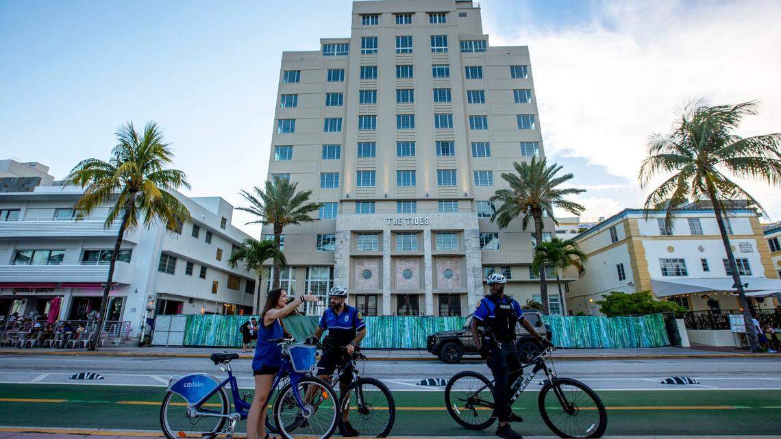 A cyclist speaks to police on Ocean Drive in Miami Beach on Friday, May 27, 2022.