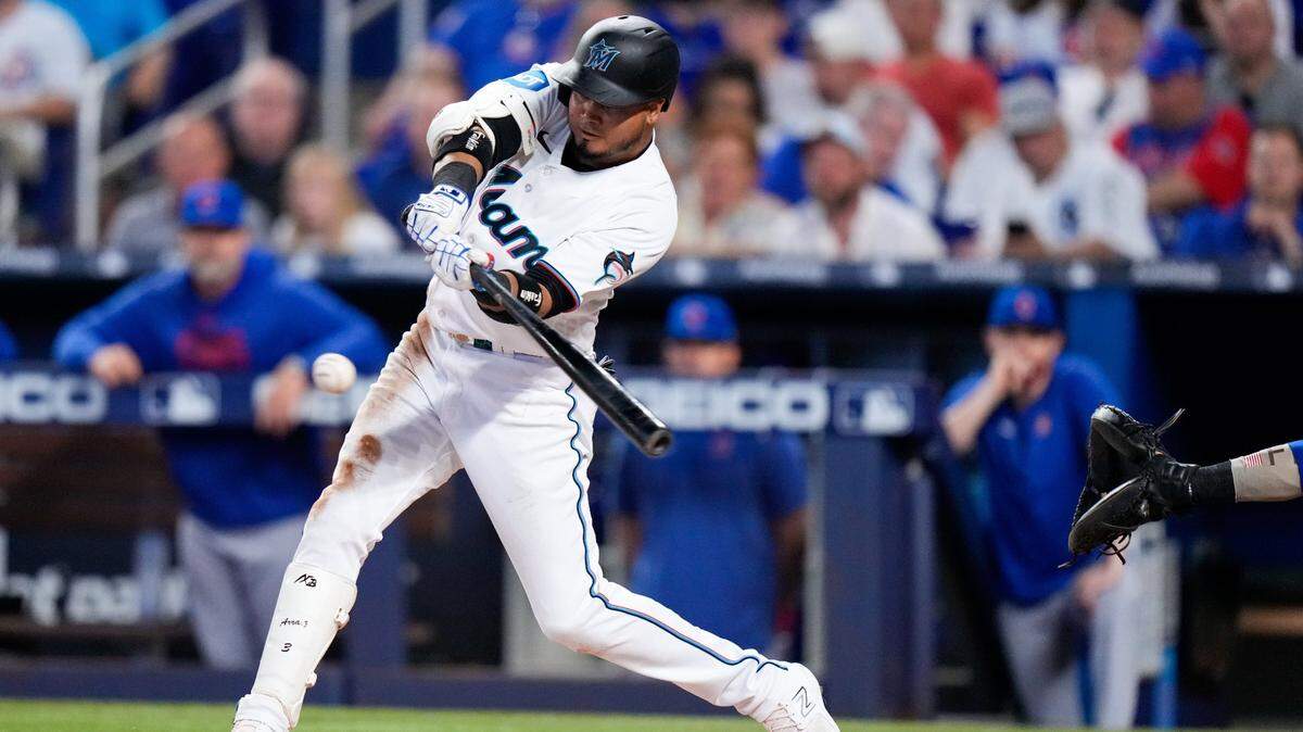 Apr 30, 2023; Miami, Florida, USA; Miami Marlins second baseman Luis Arraez (3) hits a single against the Chicago Cubs during the fourth inning at loanDepot Park. Mandatory Credit: Rich Storry-USA TODAY Sports