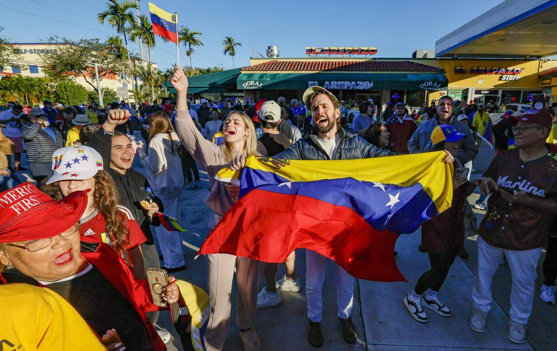 Venezulans celebrate outside of El Arepazo in Doral, Florida, after the United States attacked Venezuela and captured Venezuelan leader Nicolás Maduro, on Saturday, January 3, 2026. 
