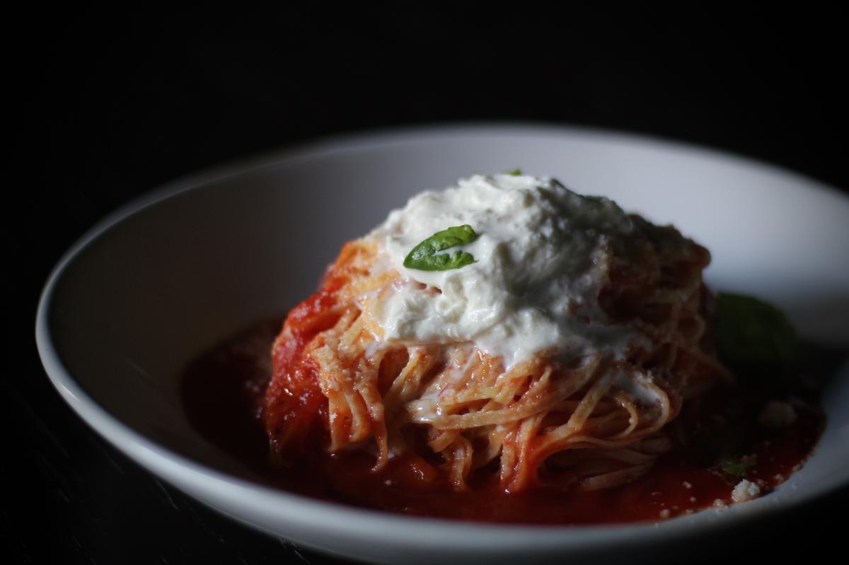 Pasta topped with burrata at Gino’s Bottegga Italiana.