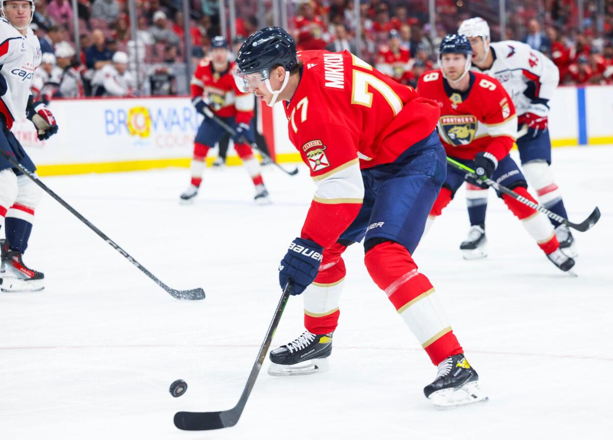 Florida Panthers defenseman Niko Mikkola (77) scores his first goal of the season with an assist by Florida Panthers center Sam Bennett (9) during the first period of a game on Monday, Nov. 25, 2024, at Amerant Bank Arena in Sunrise, Fla.