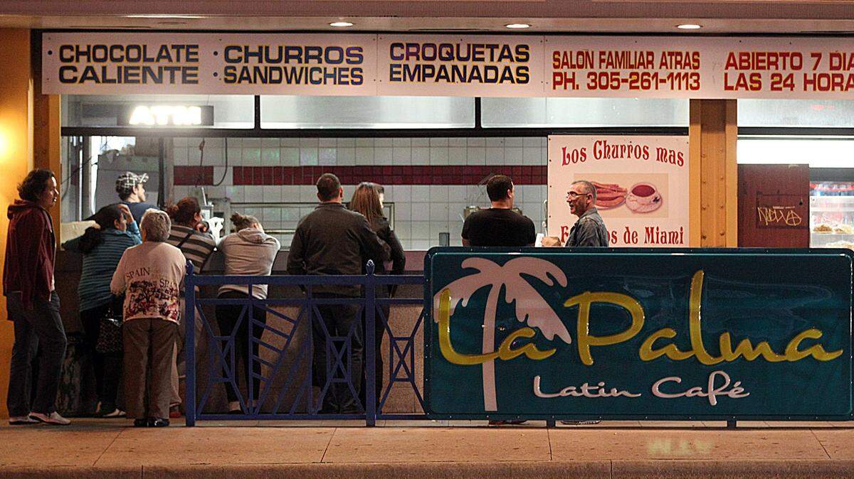 People line up to order hot chocolate and churros during a previous cold front.