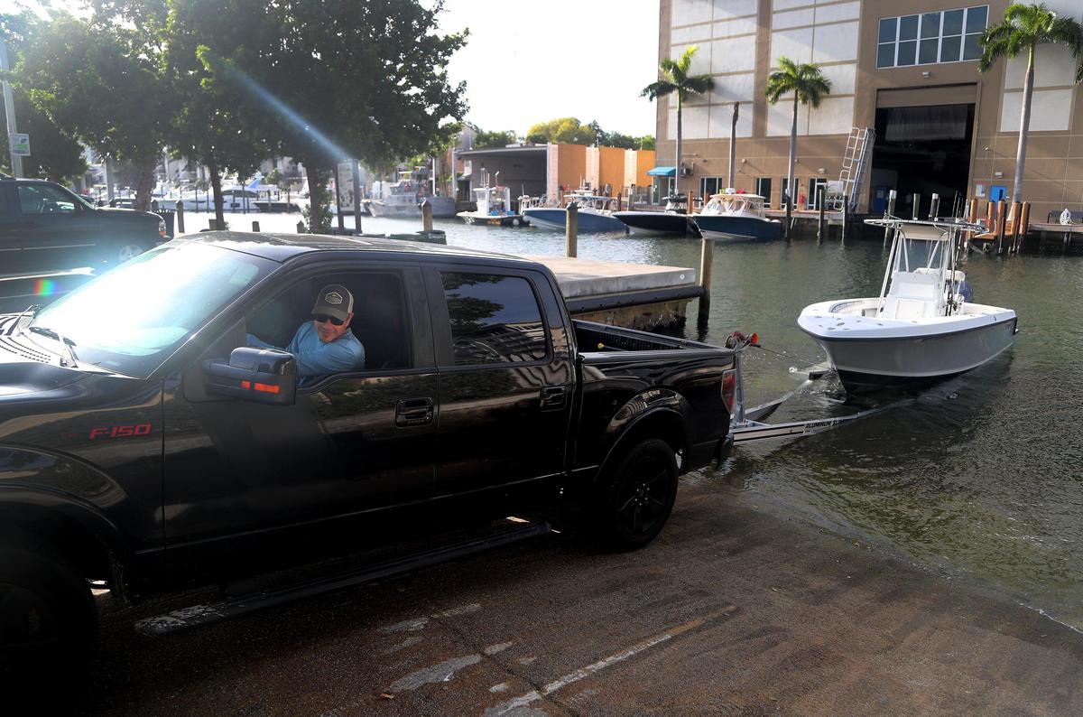 Greg Octavec backs up hi truck to launch his boat at Cox’s Landing on Wednesday April 29, 2020 in Fort Lauderdale. Boats cannot be anchored at sandbars and there must be 50 feet between boats. Boat ramps will have restricted hours, and only one boat is allowed on a ramp at a time. No more than four people can be allowed on a boat of 25 feet. ...SOUTH FLORIDA OUT; NO MAGS; NO SALES; NO INTERNET; NO TV...