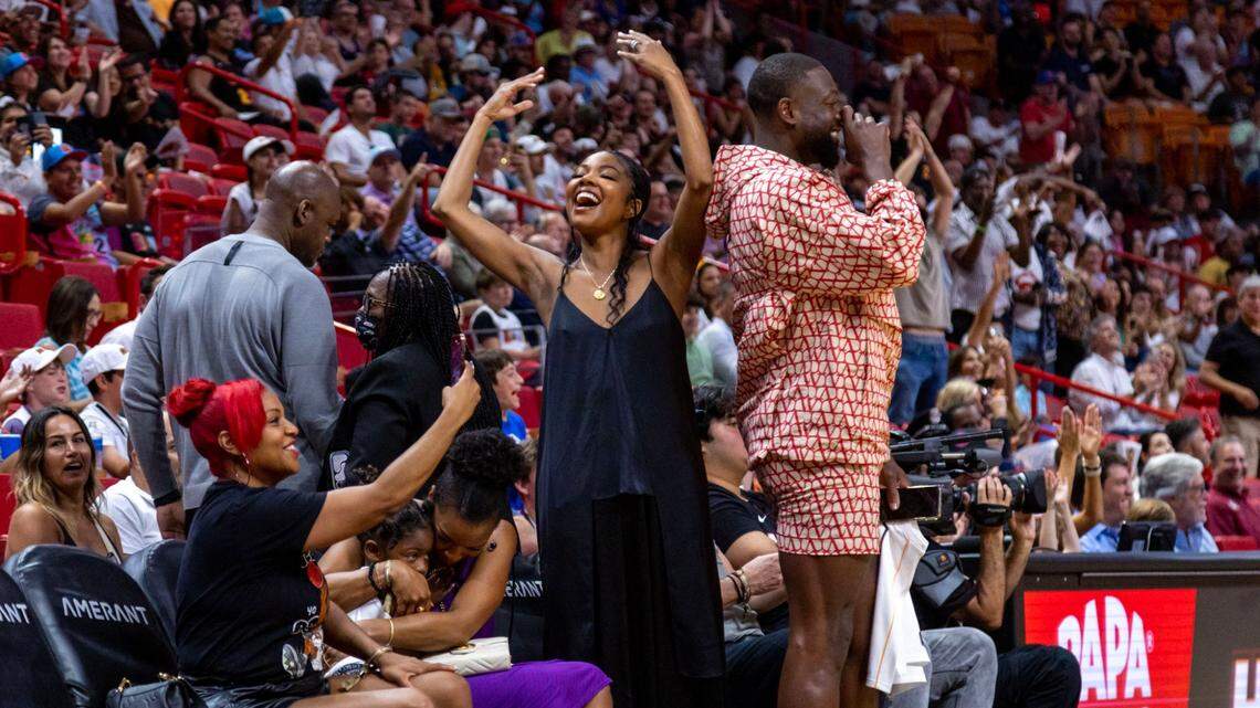 Former Miami Heat player Dwyane Wade and his wife Gabrielle Union cheer on Udonis Haslem during the first quarter of an NBA game against the Orlando Magic at Kaseya Center in Downtown Miami, Florida, on Sunday, April 9, 2023.