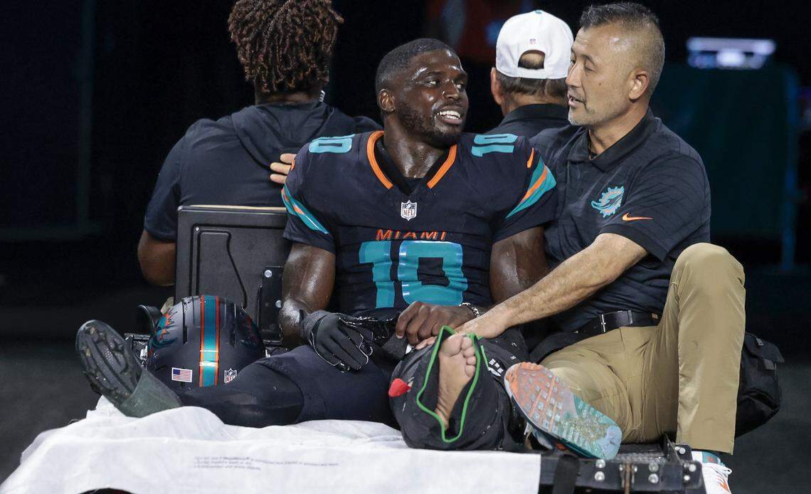 Miami Dolphins wide receiver Tyreek Hill (10) is carted off after an injury in the second half of the NFL game against the New York Jets at Hard Rock Stadium in Miami Gardens, Florida, on Monday, Sept. 29, 2025.
