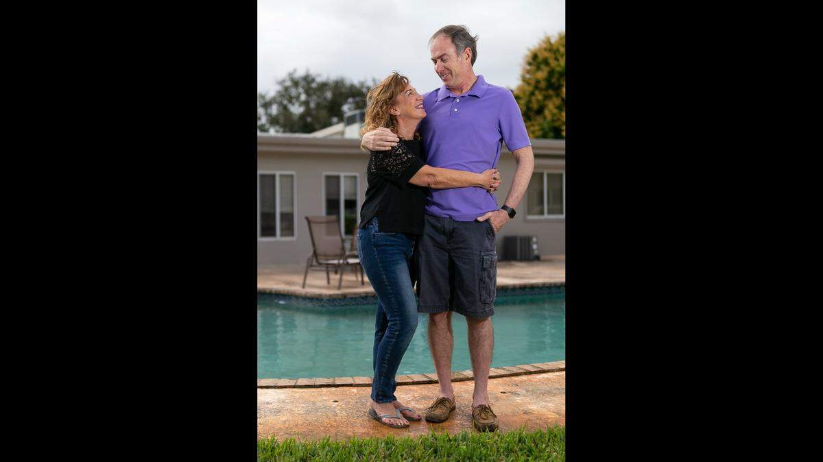 Larry VanDusseldorp and his wife, Louise, at their home in Hollywood, Florida, on Feb. 1, 2021. Larry tested positive for COVID-19 on Oct. 1, returned to work 24 days later, resumed jogging, and in late November, following a run, suffered a heart attack caused by a COVID-related blood clot.
