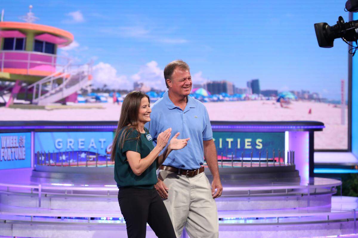 Jesse Rebhan and husband Gator Rebhan on the Wheel of Fortune set after she won $52,000, including $37,000 in the Bonus Round.