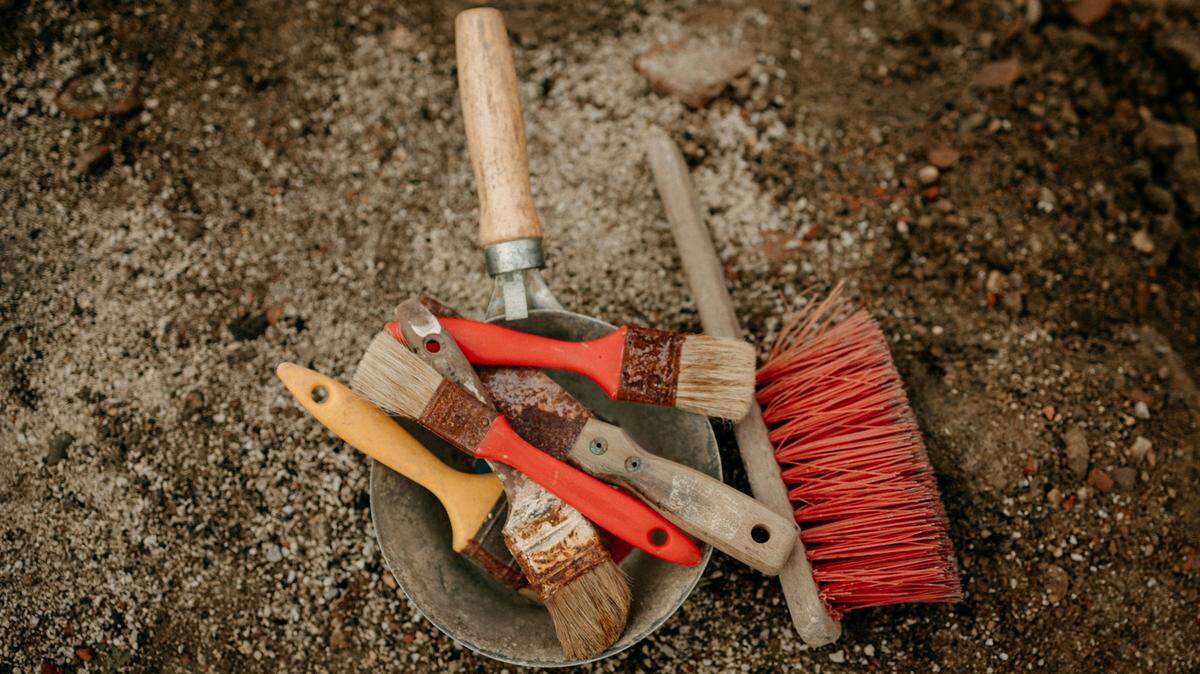 Archaeologists discovered human burials and an ancient wall under a parking lot in England, the council said.