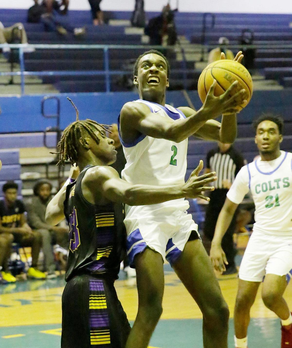 Coral Springs Colts Valter Pierre Louis (2) attempts a shot against South Plantation Paladins during BCAA Big 8 basketball boys final game on Saturday, January 27, 2024 at Fort Lauderdale HS in Fort Lauderdale. Andrew Uloza / for Miami Herald