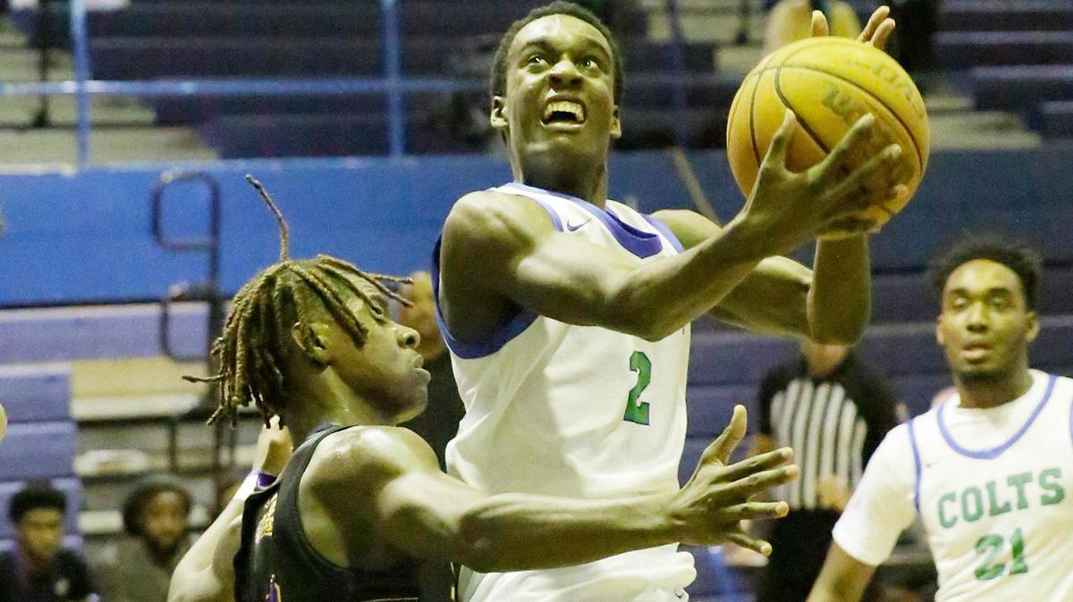 Coral Springs’ Walter Pierre Louis (2) attempts a shot against South Plantation during the BCAA Big 8 basketball boys final on Saturday, January 27, 2024 at Fort Lauderdale HS in Fort Lauderdale.