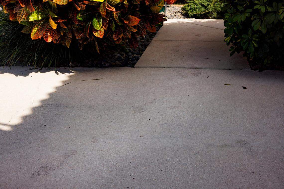 Footsteps believed to belong to Seraphine Gingles and her father Nathan Gingles are visible during the day on Tuesday, Feb. 18, 2025, at the scene of the triple homicide that happened over the weekend in Tamarac, Fla.