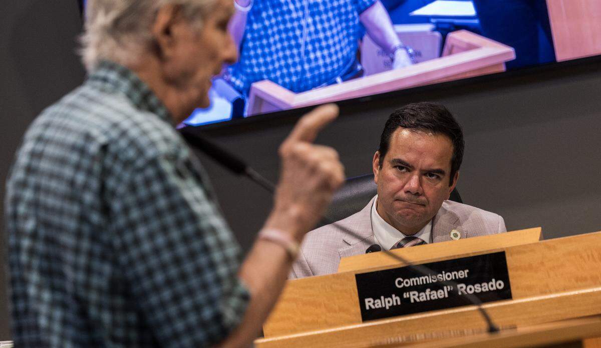 City of Miami Commissioner Ralph "Rafael" Rosado listens as a resident speaks, during a Commission meeting to discuss the proposed sale of the Olympia Theater at the Gusman Center for the Performing Arts' entire building to a public charter school, called Sports Leadership Arts Management, (SLAM), at City Hall, on Thursday September 25, 2025.