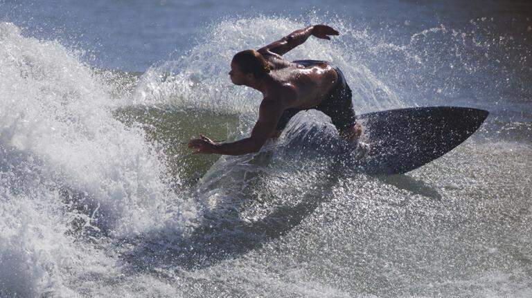 Cowabunga! Take a look at Florida surfers shredding Hurricane Erin’s waves