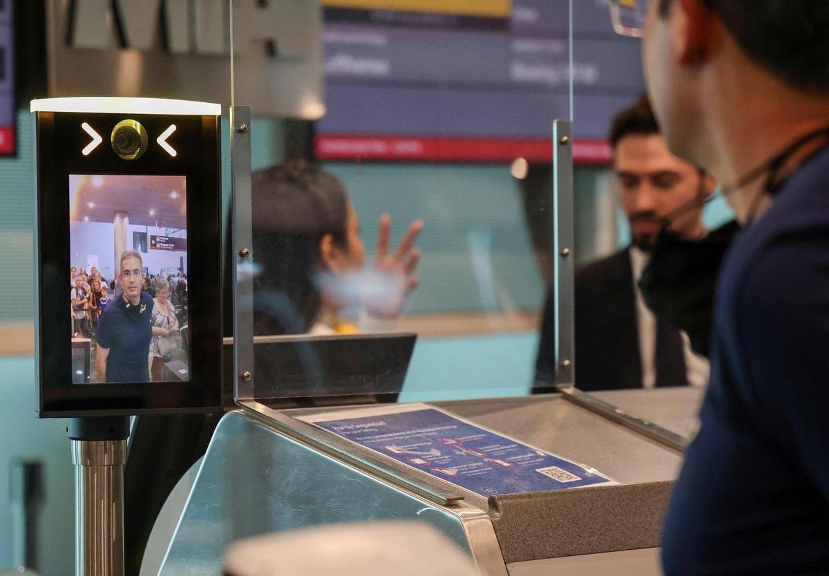 A passenger approaches the new facial-recognition camera to have his picture taken at Gate J17 at Miami International Airport on Wednesday Aug. 9, 2023, before boarding a Lufthansa flight to Germany.