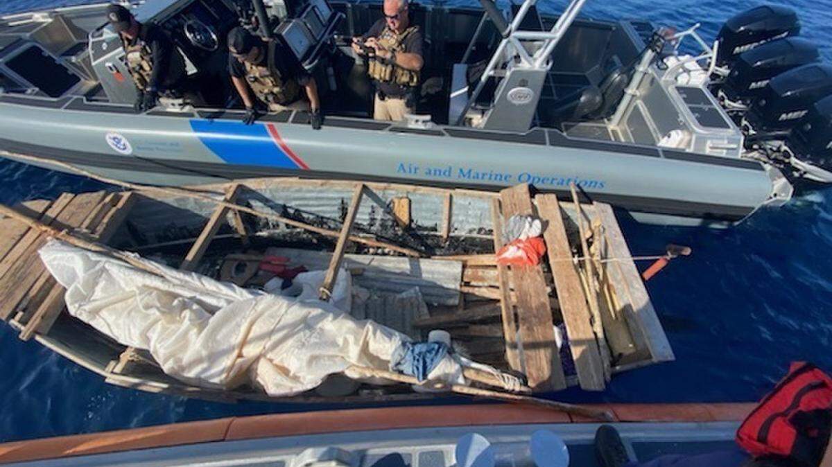 A Coast Guard Station Islamorada crew and a U.S. Customs and Border Protection Air and Marine Operations crew interdict a rustic vessel on Feb. 8, 2021, off the Florida Keys.