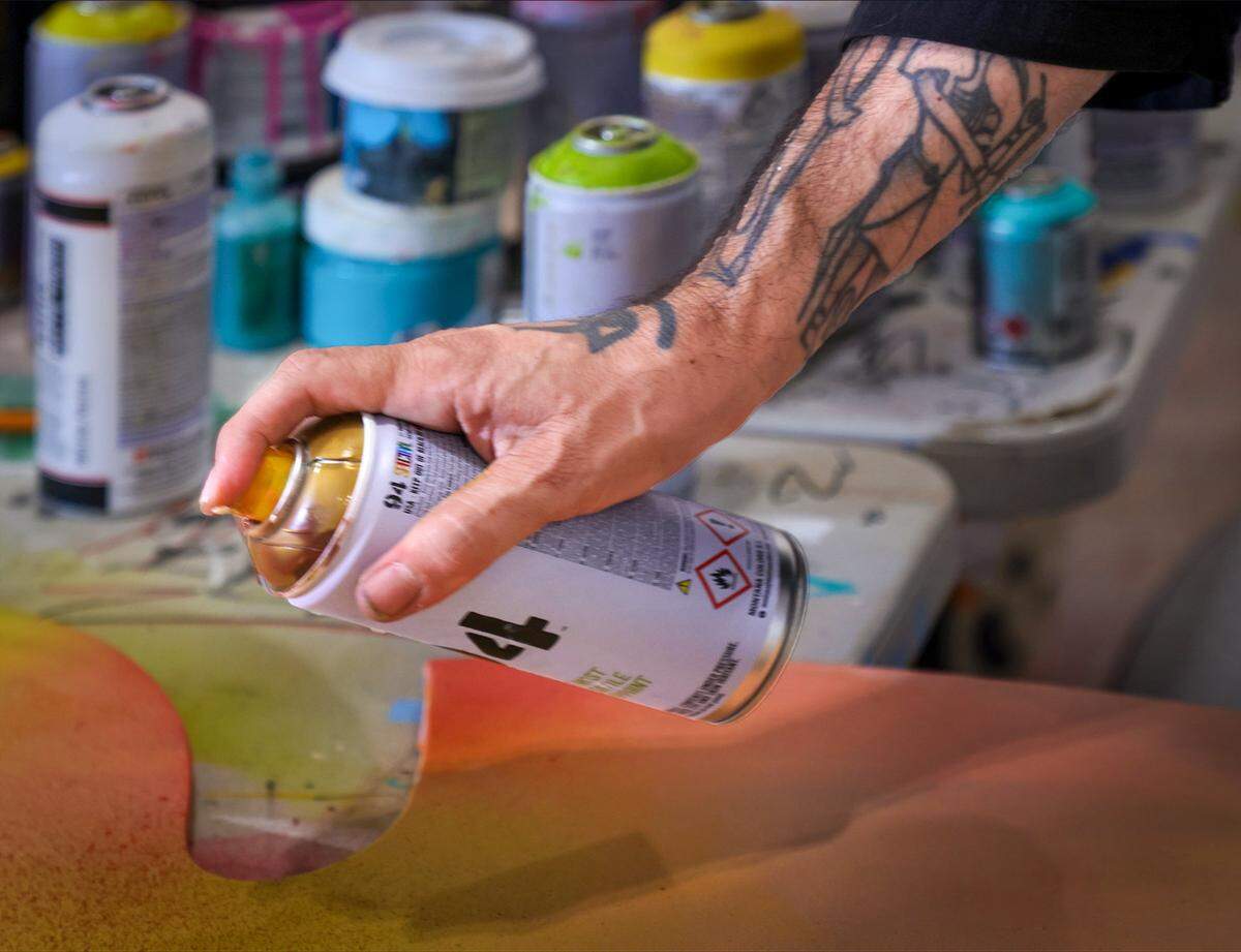 James “Ras Terms” Monk sprays paint while working on a new piece at The Museum of Graffiti Artist Studios in Wynwood, Miami, Tuesday, April 7, 2026. 