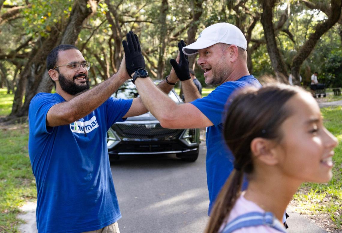 Herman (right) and Ali Cabala (left), b camera operator, high five after finishing up a 12-hour shoot day. “The best part is delivering something that you are a part of creating to the client, and they’re excited about it, and they feel like it represents their business in a really nice way,” Herman said.