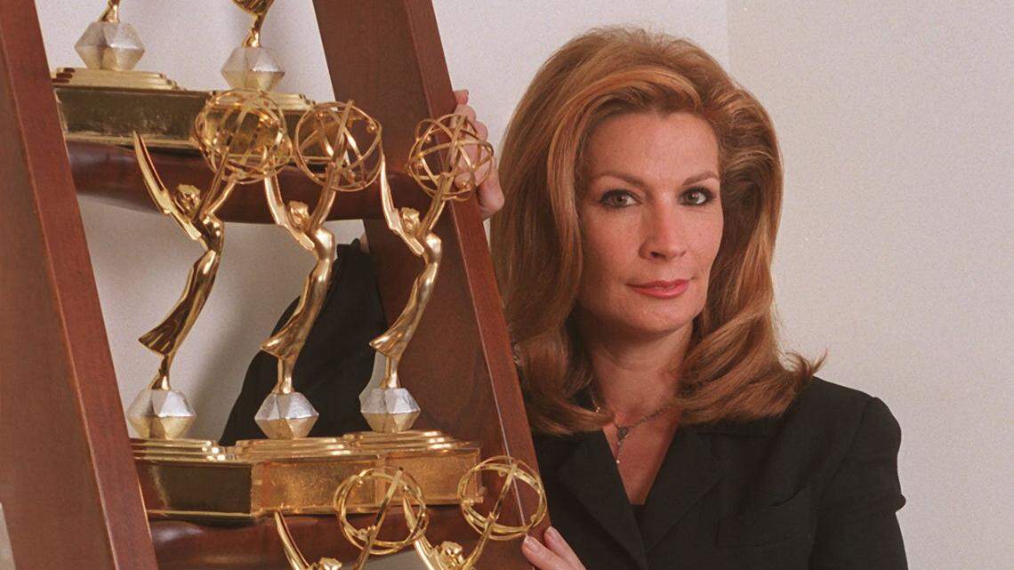 Michele Gillen, a former investigative reporter for WFOR-CBS4, is pictured in 2000 with some of the regional Emmys she won during her career.