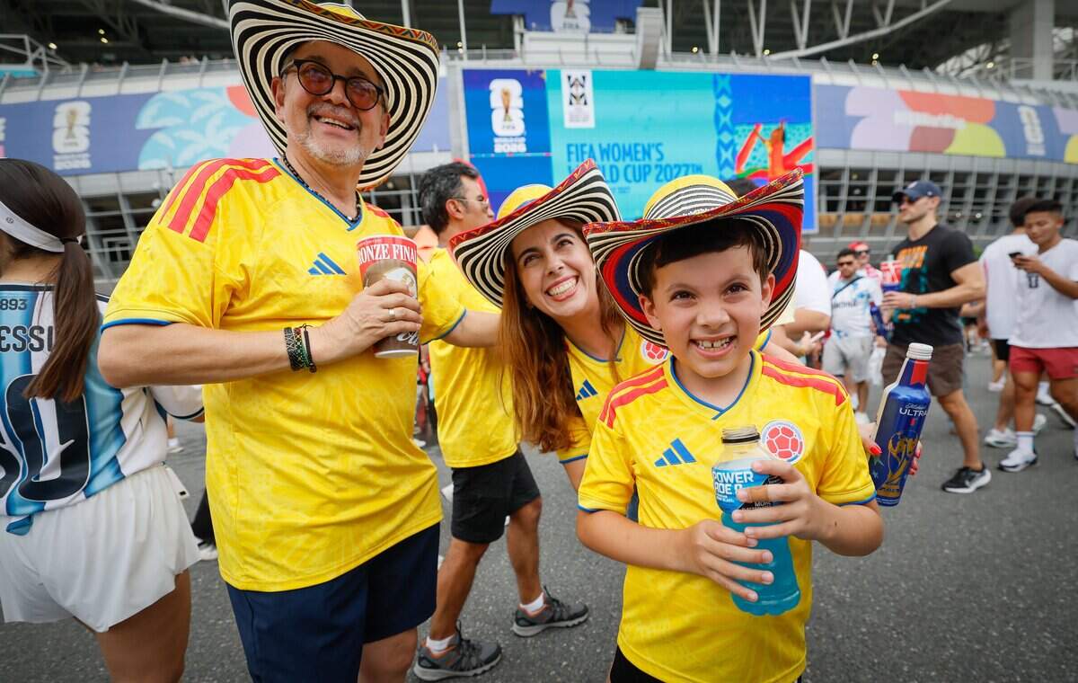 Dressed as Colombia fans, Armando Zuniga, Laura Zunig and Juan Hernandez, 8, arrive before the start of FIFA World Cup 2026 third-place soccer match between France and England at Hard Rock Stadium (Miami Stadium) on Saturday, July 18, 2026 in Miami Gardens, Fla.