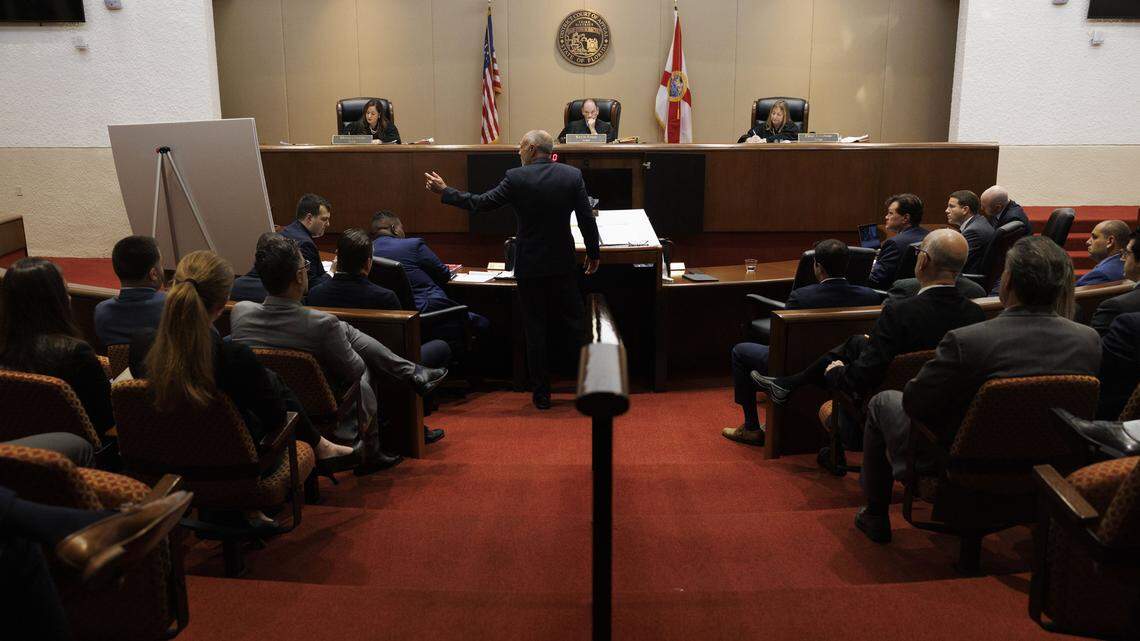 Alan Lawson, attorney for Emilio González, points to a printed 1855 Miami Constitution during a hearing at the Third District Court of Appeal for a case González brought against the City of Miami on Tuesday, July 29, 2025, in Miami. A lower court judge ruled in favor of González, declaring the city's ordinance to be unlawful. The judge said changing the election date requires amending the City Charter, which requires voter approval. The city appealed the decision.