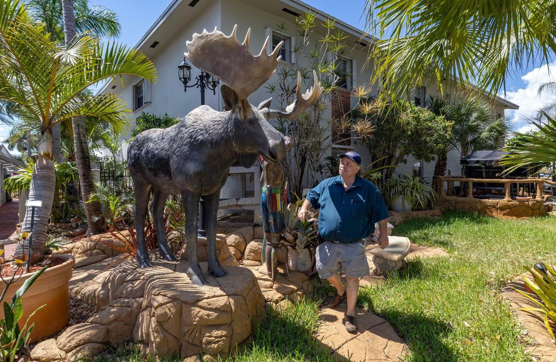 Richard Clavet walks past a statue of a moose he brought from Canada at one of the Canadian-themed hotels and motels he owns along South Federal Highway in Hollywood. Clavet is from Quebec and has served Canadian clientele for decades in Hollywood, Florida. This season, business is off, he says, due to President Trump’s tariffs and talk of annexing Canada as America’s 51st state.