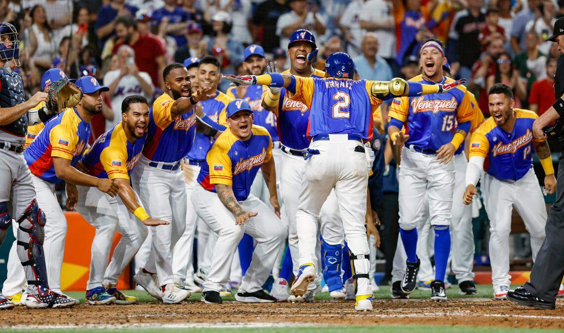 Venezuela Luis Arraez (2) celebrates with teammates after hitting a home run on a fly ball to right field in the seventh inning against the USA during the World Baseball Classic quarterfinal at loanDepot Park in Miami on Saturday, March 18, 2023. 