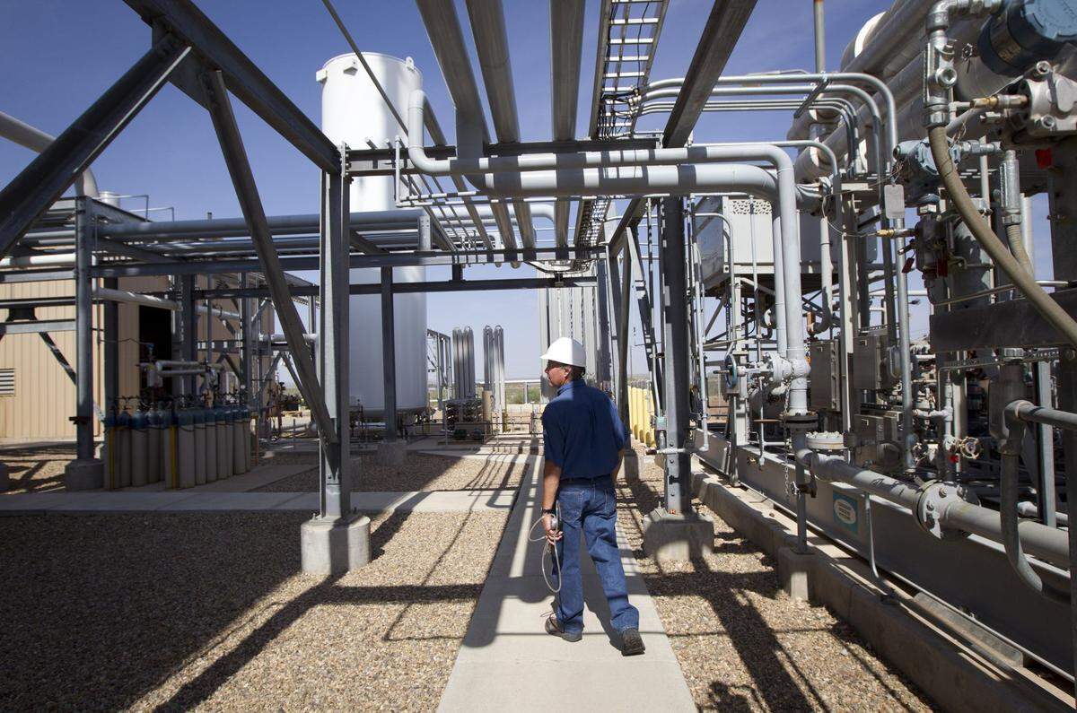The Federal Helium Reserve is located about 20 miles northwest of Amarillo. Helium plant operator Deward Cawthon walks through the Federal Crude Helium Enrichment Unit, a BLM-owned facility, on Wednesday, July 6, 2011.