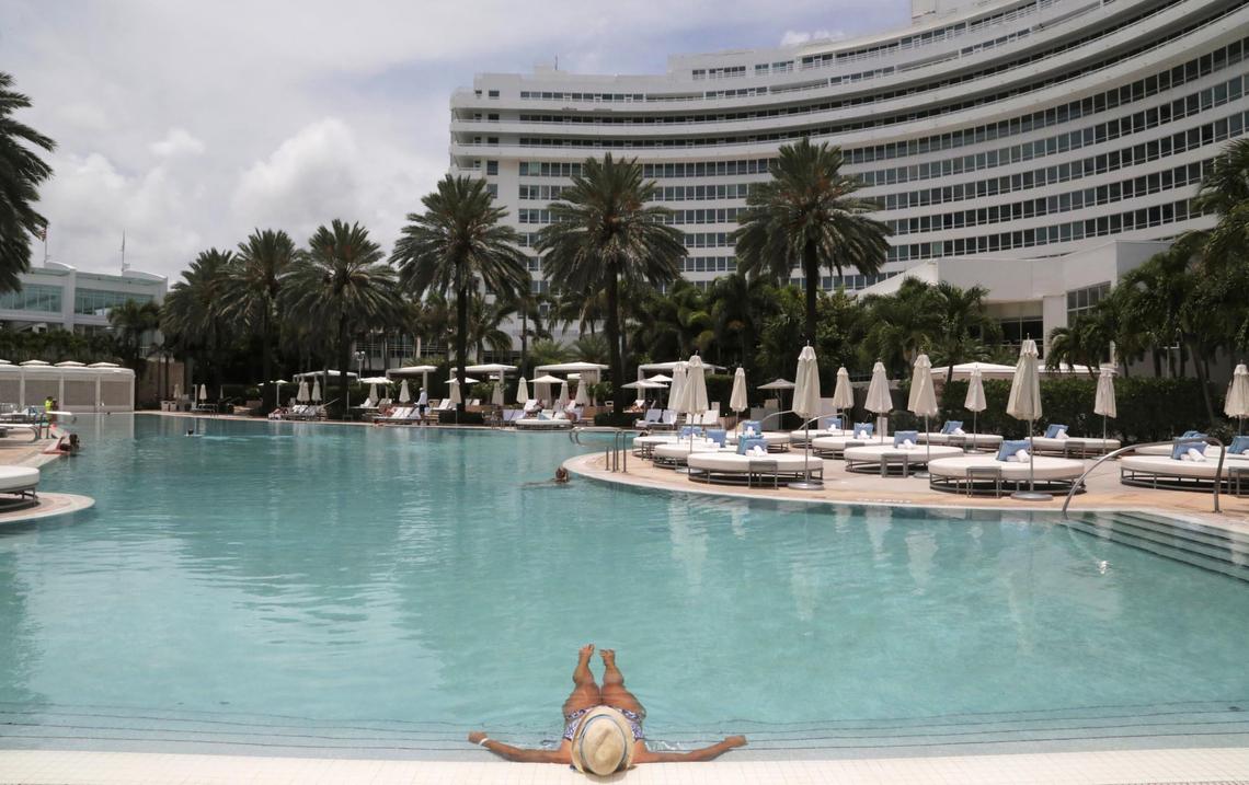 A hotel guest enjoys having the pool practically to herself at Fontainebleau Miami Beach. The hotel reopened June 1, 2020, after having to shut down due to the coronavirus pandemic.