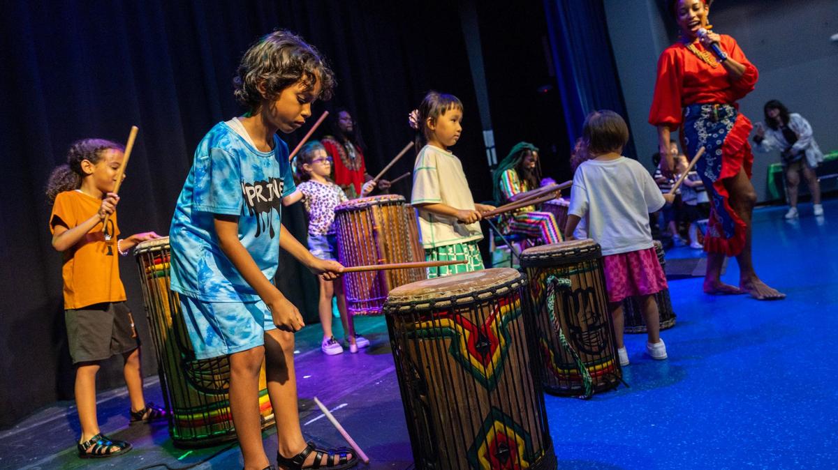 Kids participate by drumming along to the beat during a traditional African dance show led by Maryann Arnita Payne during a Juneteenth celebration at Miami Children’s Museum on Wednesday, June 19, 2024, in Miami, Fla.