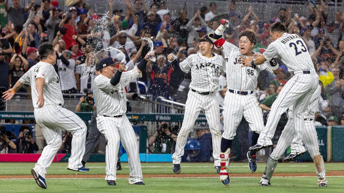Japan infielder Munetaka Murakami (55) celebrates with his teammates after defeating Mexico 6 to 5 during their semifinal game at the World Baseball Classic at loanDepot Park on Monday, March 20, 2023, in Miami, Fla.