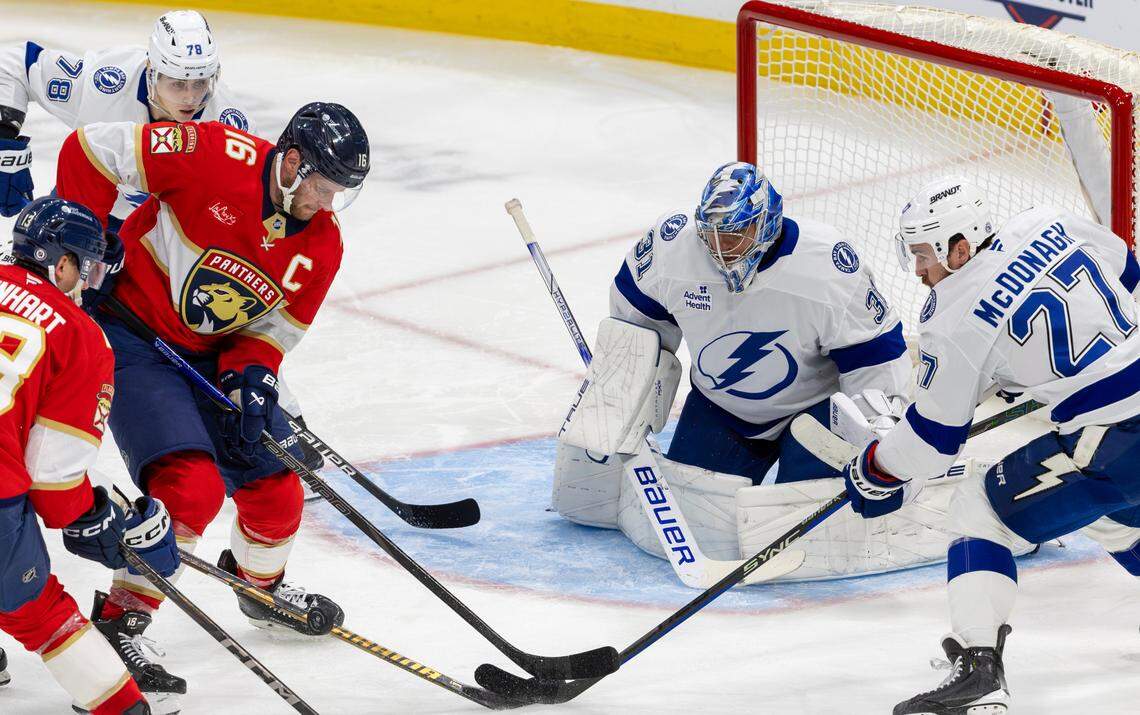 Tampa Bay Lightning goaltender Jonas Johansson (31), defenseman Ryan McDonagh (27), and defenseman Emil Lilleberg (78) defend against Florida Panthers center Aleksander Barkov (16) during the second period of an NHL game at Amerant Bank Arena in Sunrise, Fla., on Monday, Dec. 23, 2024.