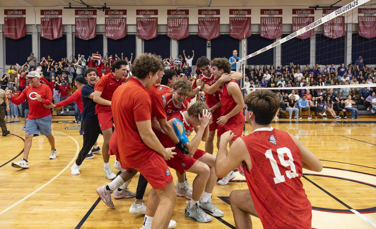 Columbus Explorers celebrate after defeating the Southwest Eagles in their high school volleyball regional final at Christopher Columbus High School on Friday, May 8, 2026, in Miami, Fla.