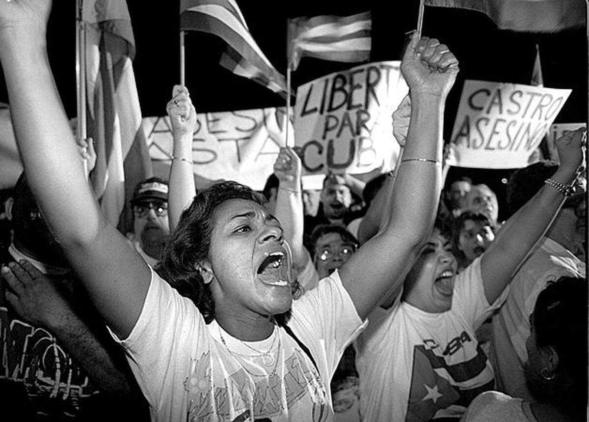 Irma Roman joins hundreds of others protesting against Cuba shooting down Brothers to the Rescue planes. The were outside the Brothers to the Rescue hangar at Opa-locka airport.