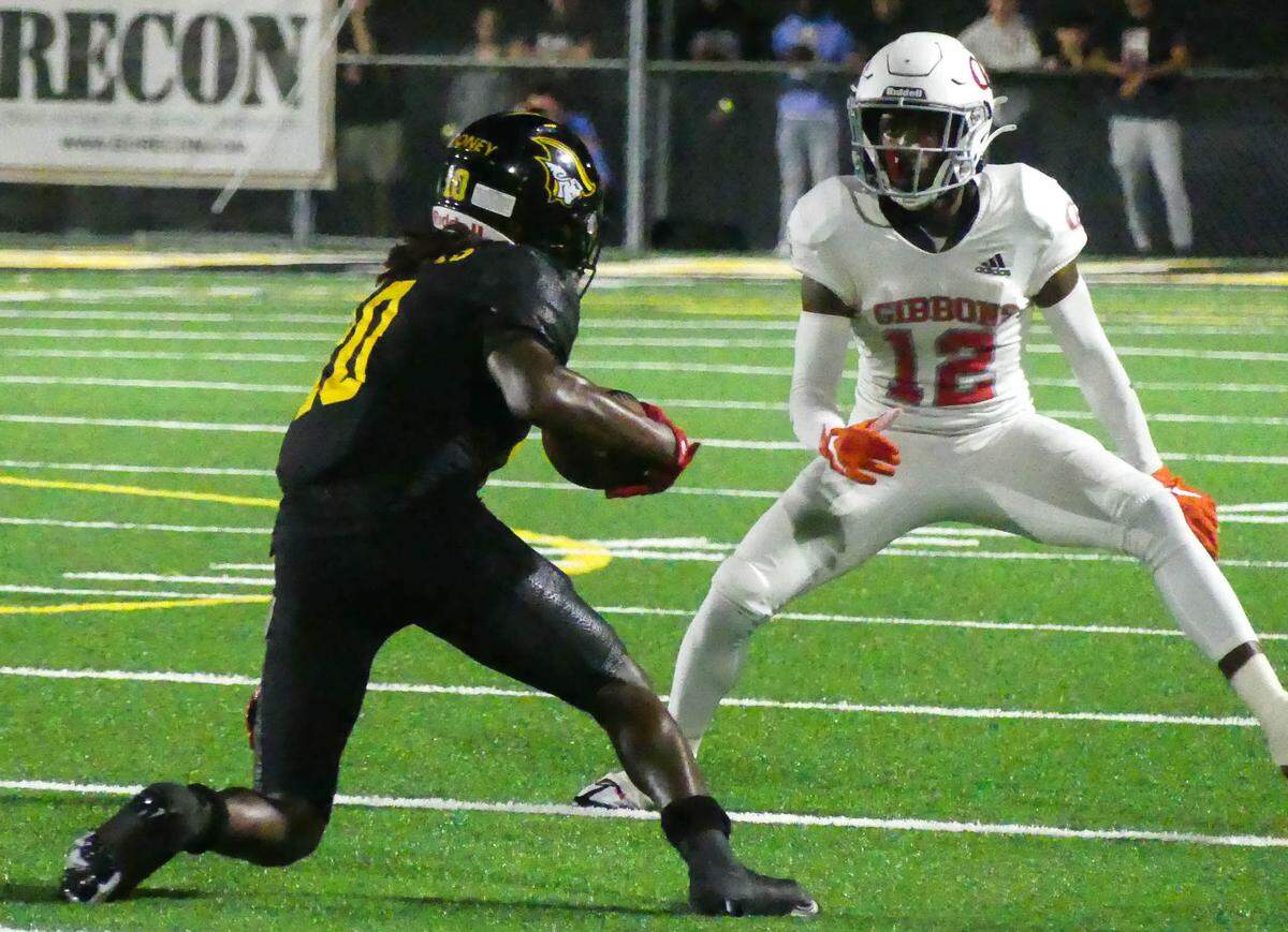 American Heritage had home field advantage in their playoff game against Cardinal Gibbons Friday, Nov. 25th. WR Malachi Toney of the Patriots runs the ball against defender CB Johnel Mauvais of the Chiefs in first half action.