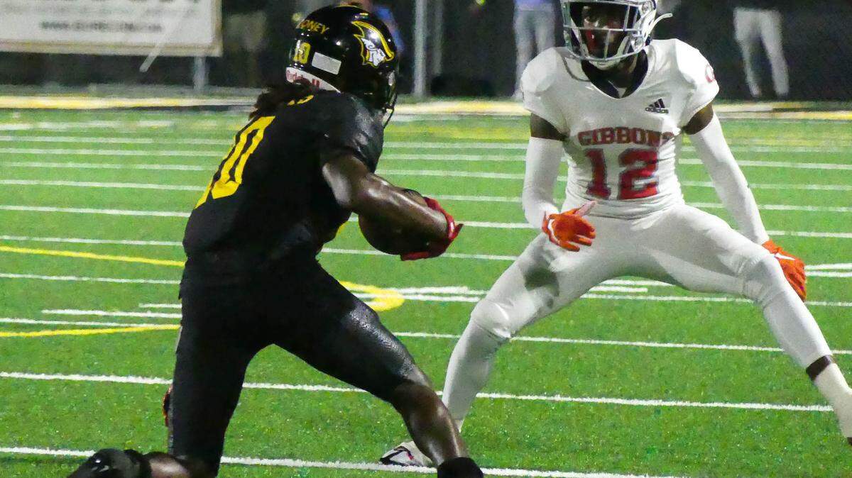 American Heritage had home field advantage in their playoff game against Cardinal Gibbons Friday, Nov. 25th. WR Malachi Toney of the Patriots runs the ball against defender CB Johnel Mauvais of the Chiefs in first half action.