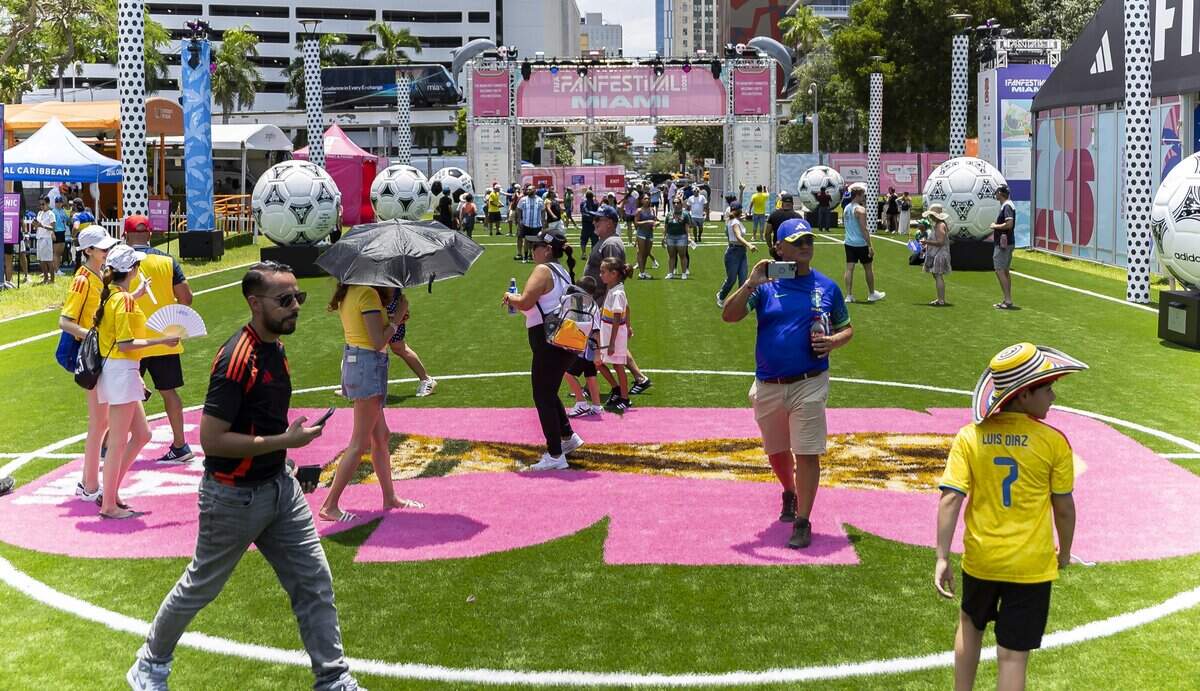 People make their way through the FIFA Fan Festival Miami at Bayfront Park on Saturday, June 13, 2026, in downtown Miami, Fla.
