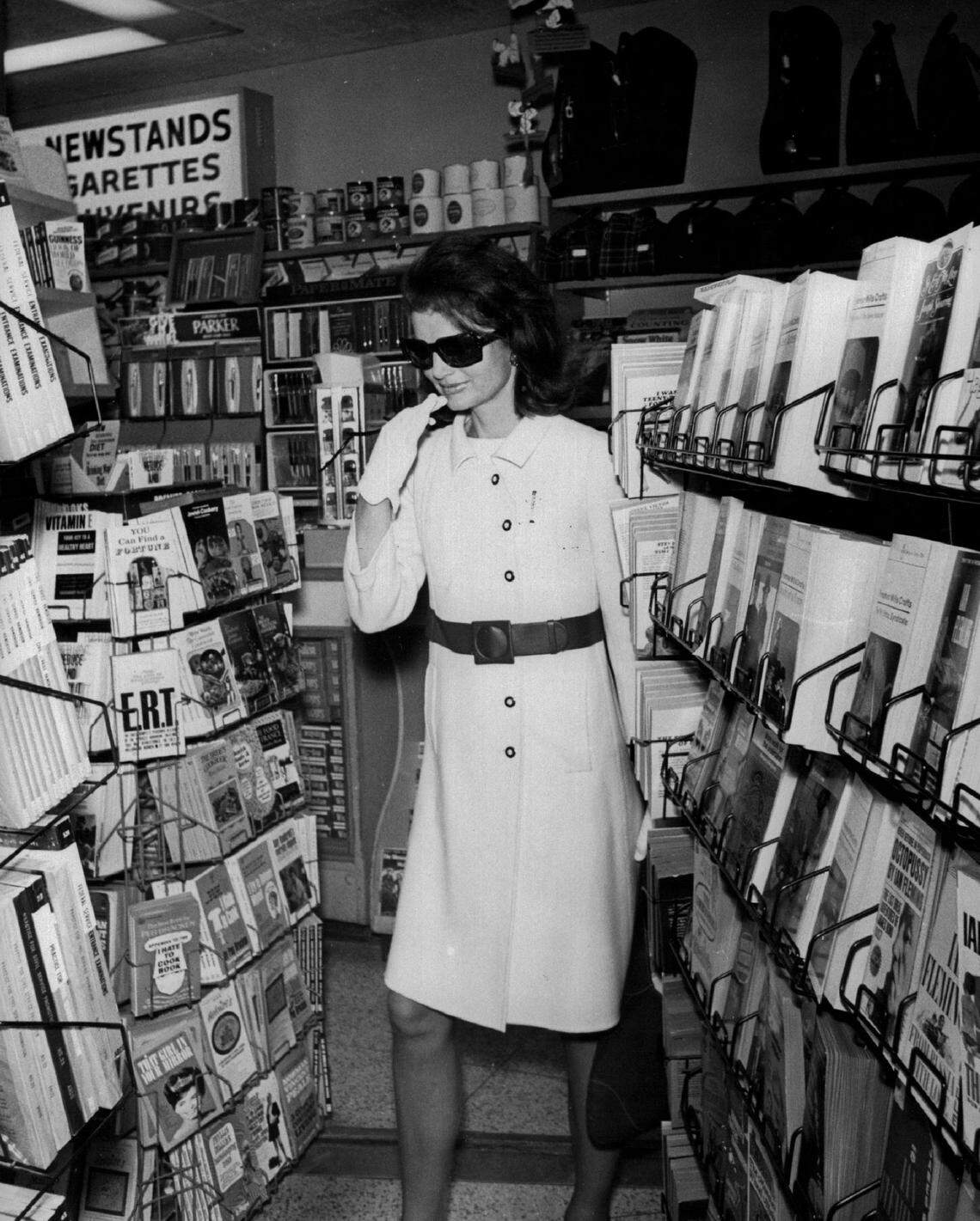 Jacqueline Kennedy browses at a Miami airport store in 1968.