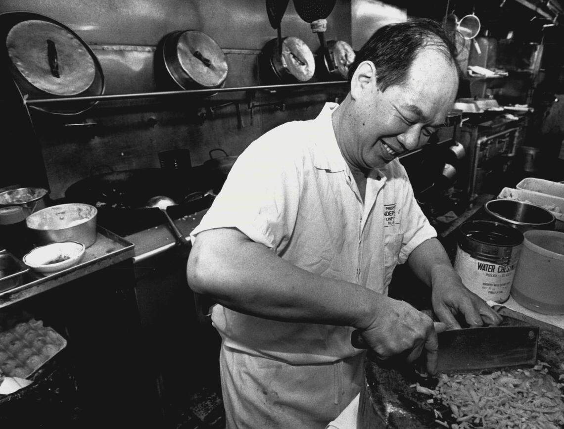Chef Jesus Li chops carrots in the kitchen at Fu Manchu in 1988.