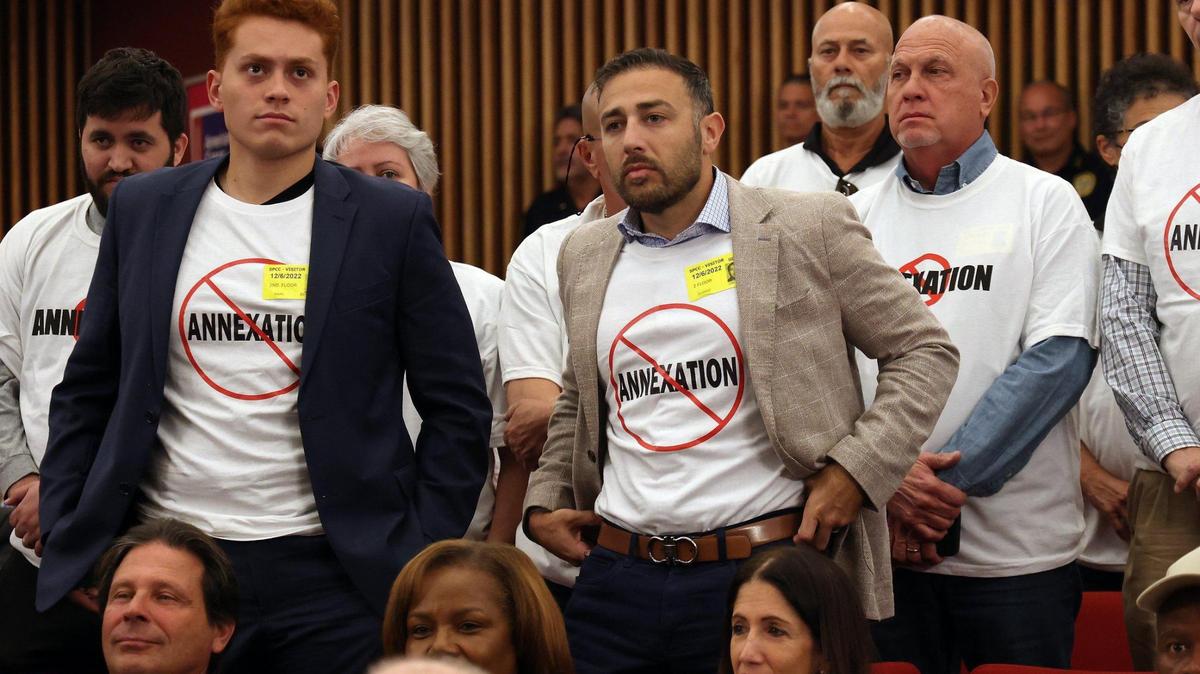 As Miami-Dade County commissioners voted to reconsider annexations by Medley and Virginia Gardens on Tuesday, Dec. 6, 2022, a group that included commercial property owners in the Virginia Gardens area rose in protest of the decision.