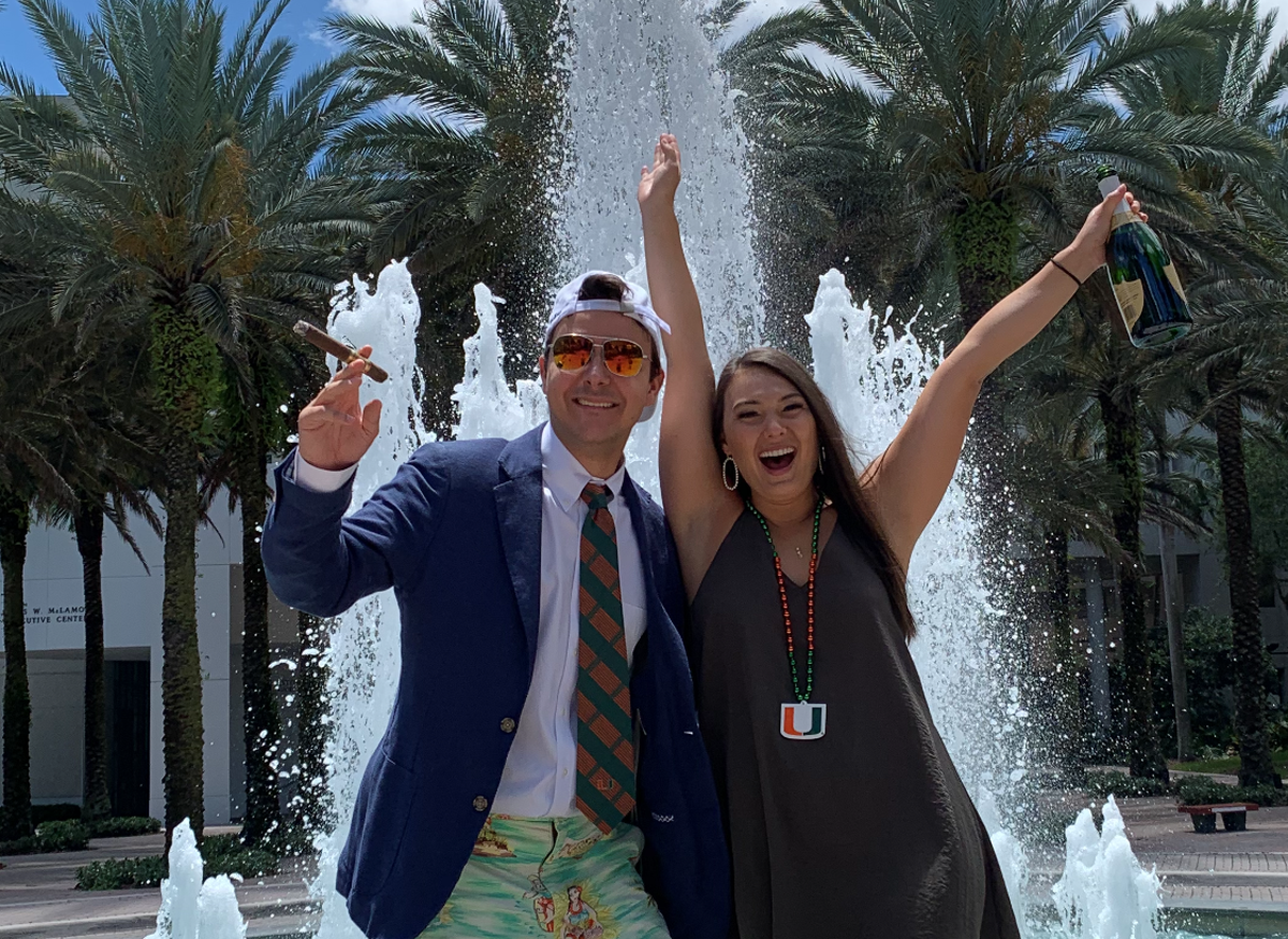 Alex Cohorsky and Remi Petit, a couple, took their own graduation pictures on the University of Miami campus April 28, the last day of their online classes, because they won’t have a formal graduation ceremony until December.