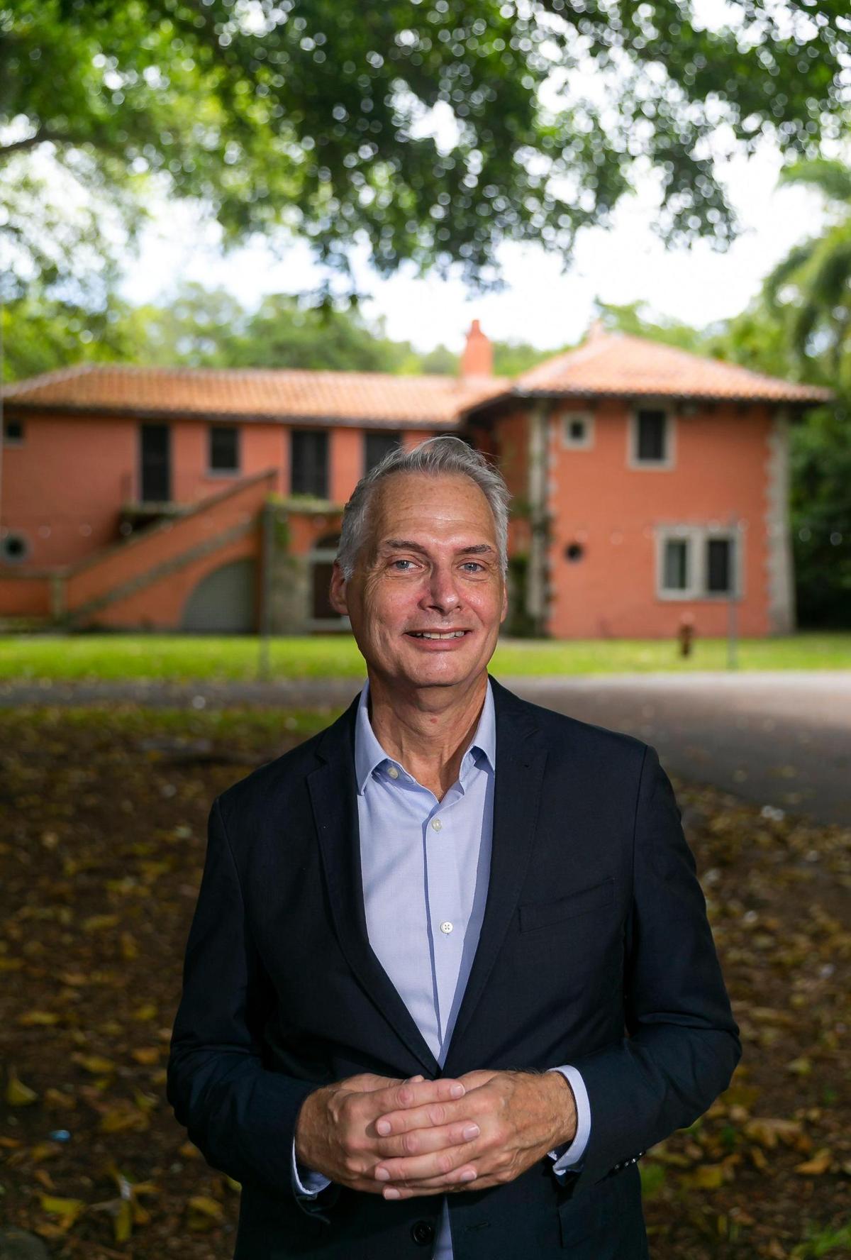 Joel Hoffman, executive director and CEO of the Vizcaya Museum & Gardens, is photographed in front of the Vizcaya Village’s staff residence on Monday, July 25, 2022, in Miami, Fla. Vizcaya Village, which sits across the former Miami Museum of Science and consists of 11 historic buildings, will be undergoing a multimillion-dollar expansion.