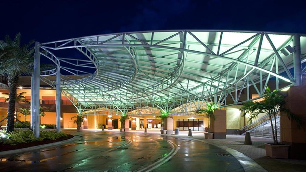 A large canopy created by Miami Awning is at an entrance of Dolphin Mall.