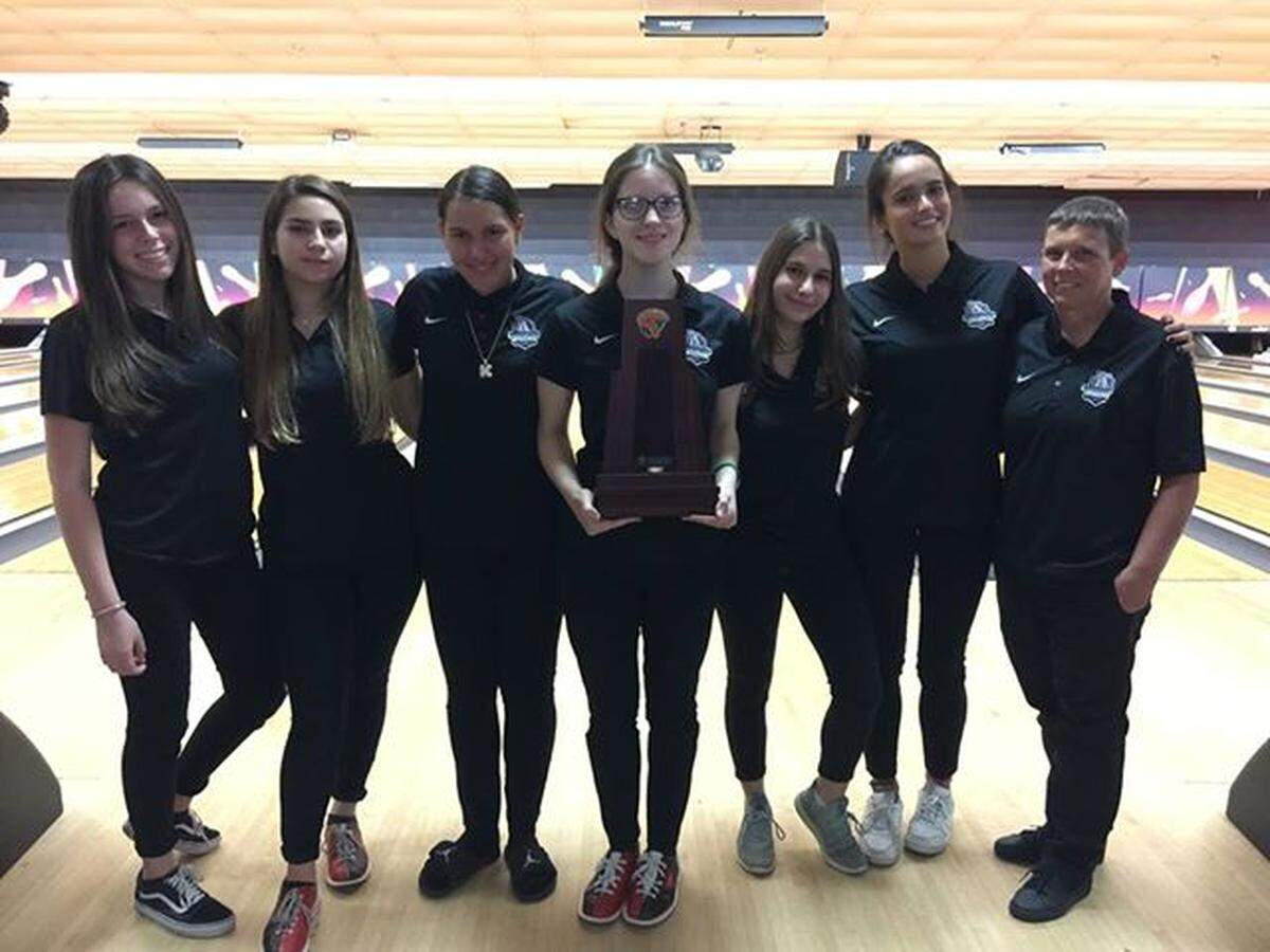 The girls bowling team at Dr. Michael Krop High School placed first in the Miami-Dade County District 13 Bowling Championship. From left are: Sophia Palmeiro, Rebecca Vainstein, Kirra Magana, Marissa Manley, Molly Kaufman, Gabriela Pardo, and Coach Amy McMillan.