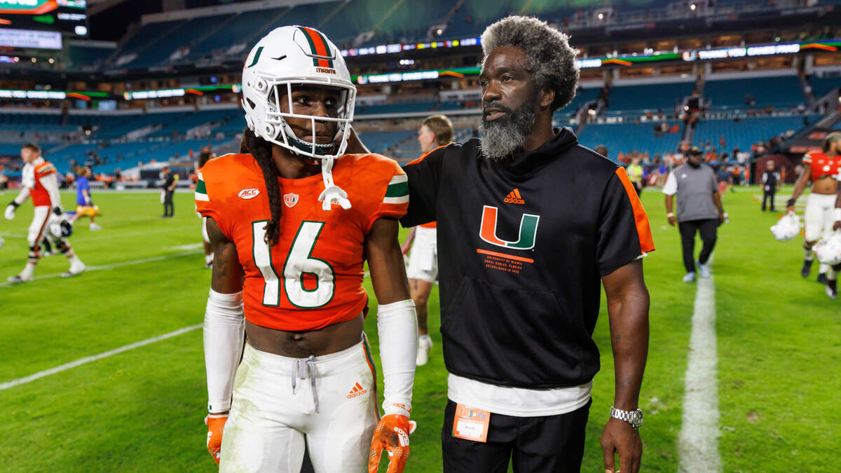 Miami Hurricanes cornerback Malik Curtis (16) and Hurricanes senior football advisor Ed Reed walk off the field after the Hurricanes lost to the Pittsburgh Panthers during an ACC conference football game at Hard Rock Stadium on Saturday, November 26, 2022 in Miami Gardens, Florida.