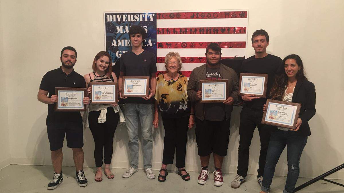 Ilajean Horowitz, center, celebrates with first place winners in the 13th annual Quest for Peace Art Competition. The winners in six categories are, from left: Andres Castano, Jennifer Williams, Anthony Campos, Jonathan Bravo, Joshua Zepeda and Monia Meluzzi.