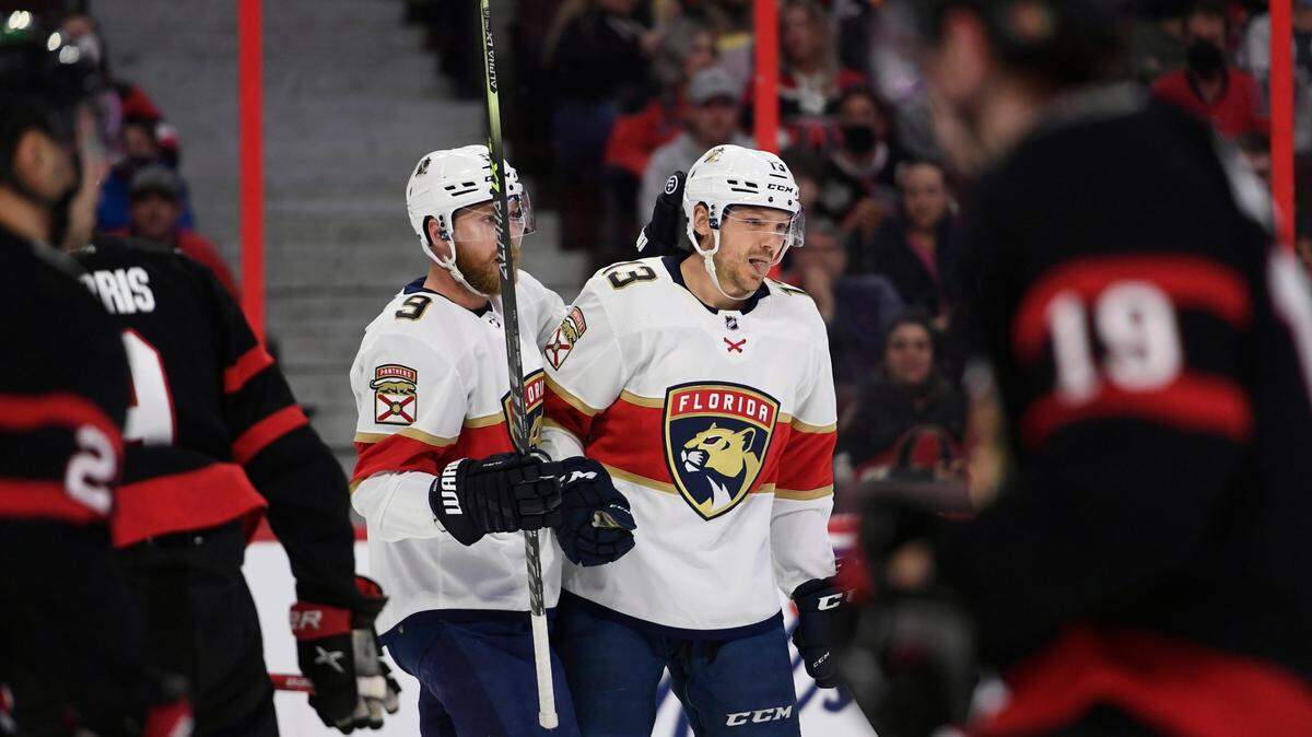 Florida Panthers center Sam Reinhart (13) celebrates his goal against the Ottawa Senators with Sam Bennett (9) during the first period of an NHL hockey game Thursday, April 28, 2022, in Ottawa, Ontario. (Justin Tang/The Canadian Press via AP)