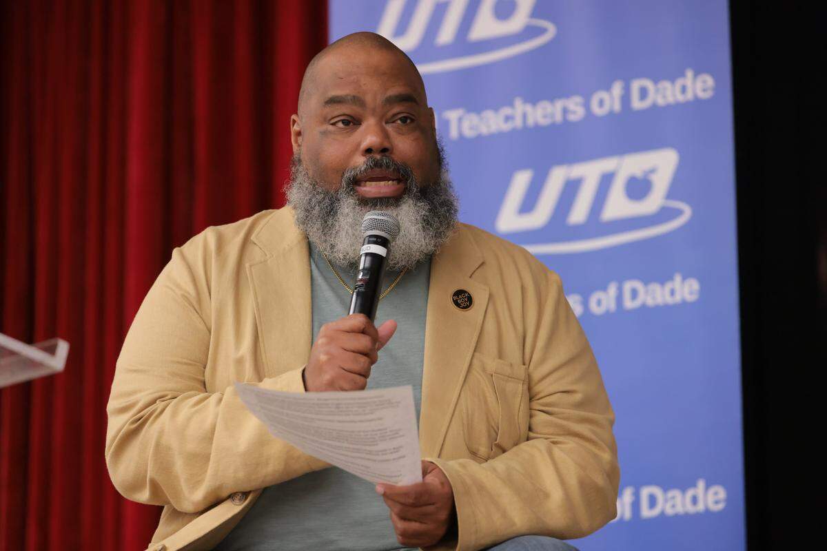 Former Florida State Senator Dwight Bullard moderates a conversation between United Teachers of Dade leadership President Antonio White, First Vice President Danielle Boyer and Treasurer Mindy Grimes-Festge, during a town hall meeting hosted by United Teachers of Dade regarding the collective bargaining for the contract as well as the referendum renewal at Miami Southridge Senior High School in Miami, Florida, on Wednesday, Nov. 5, 2025.
