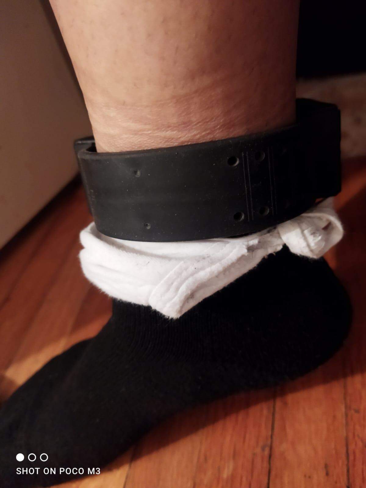 Maria Fernanda García shares a photo of the sock and mask she is using to protect herself from the contact burn of the ankle monitor she wears since coming from Colombia to the US. 