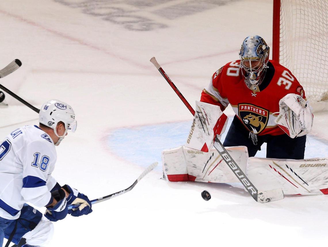 Florida Panthers goalie Spencer Knight (30) and Tampa Bay Lighting Ondrej Palat (18) during the first period of game 5 of the first round NHL Stanley Cup playoff series at the BB&T Center on Tuesday, May 24, 2021 in Sunrise, Florida.
